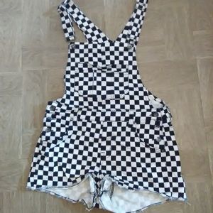 Checkered dungaree shorts.